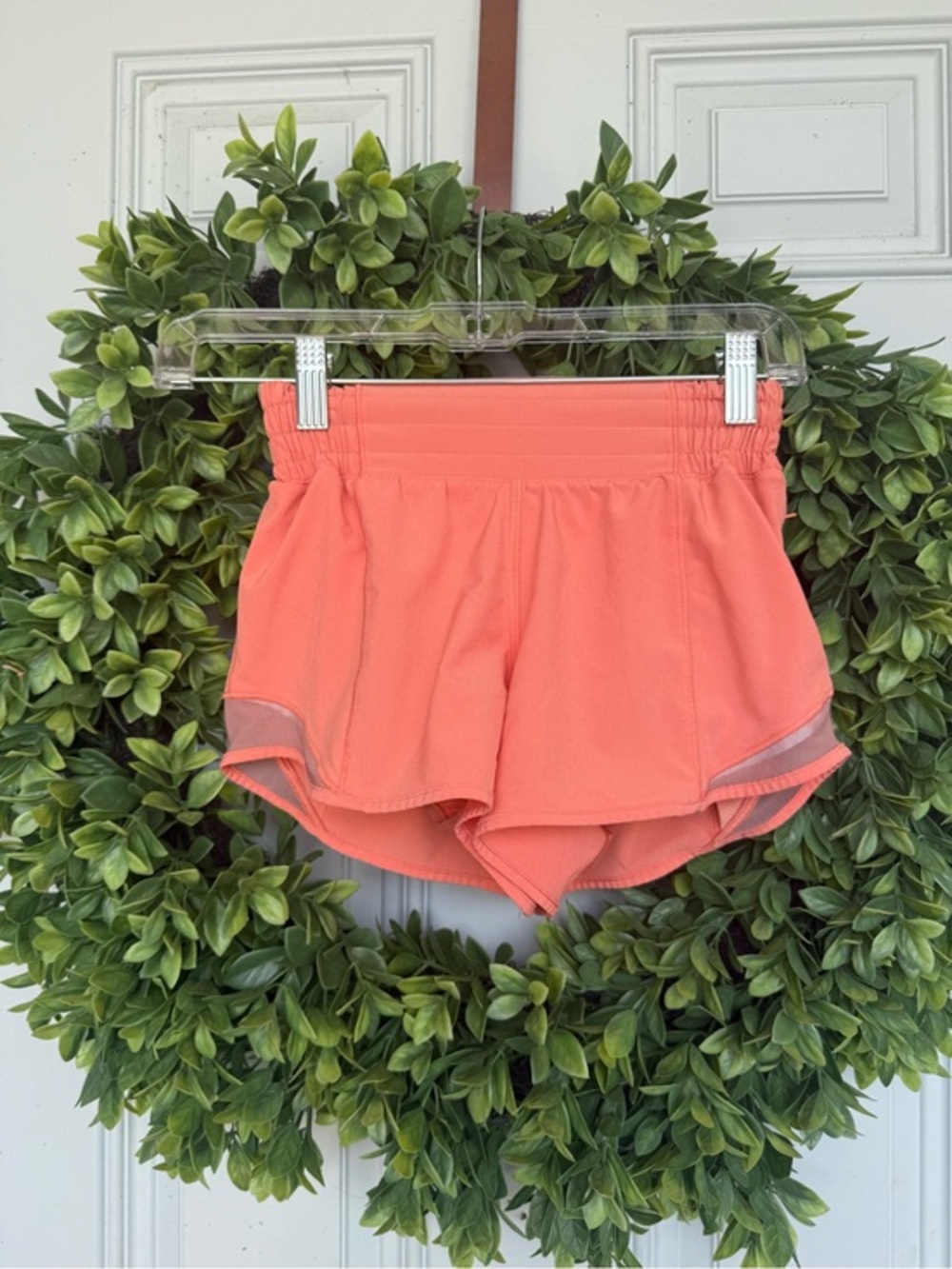 Lululemon Hotty Hot Shorts in a vibrant coral color - Picture 1 of 4